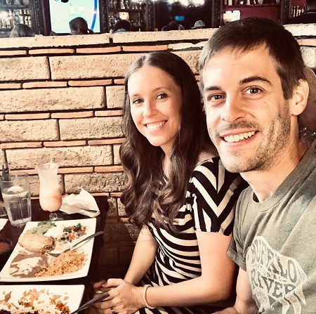 Jill Duggar Dillard and Derick Dillard on a date night at a restaurant with the pina colada on the table.